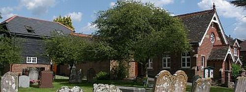 View of Slinfold Village Hall (including new extension) from churchyard