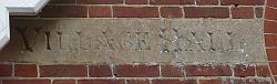 Inscription "Village Hall" on front of building